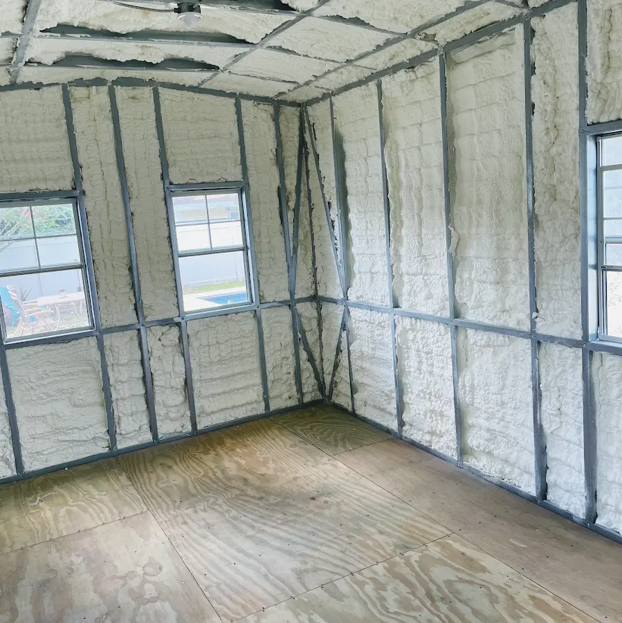 Closed-cell spray foam insulation applied to wall cavities in a residential project in Lee